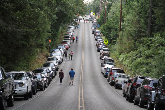 Cars line the roadside during this year’s Rotary auction. Holiday festivities and a number of unlucky accidents combined for several weekend traffic headaches for island drivers and guests last week.