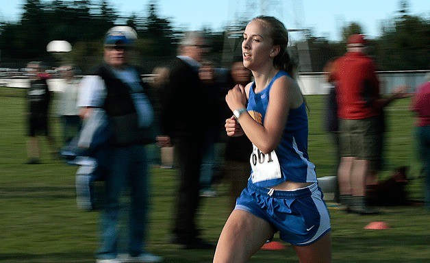 Bainbridge Island sophomore Amy Willerford sprints the last leg of the course during the cross country meet at Battle Point Park on Wednesday