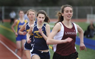 BHS freshman Isabel Ferguson (center) placed second in the 800-meter run during the Kitsap County Classic meet last week.