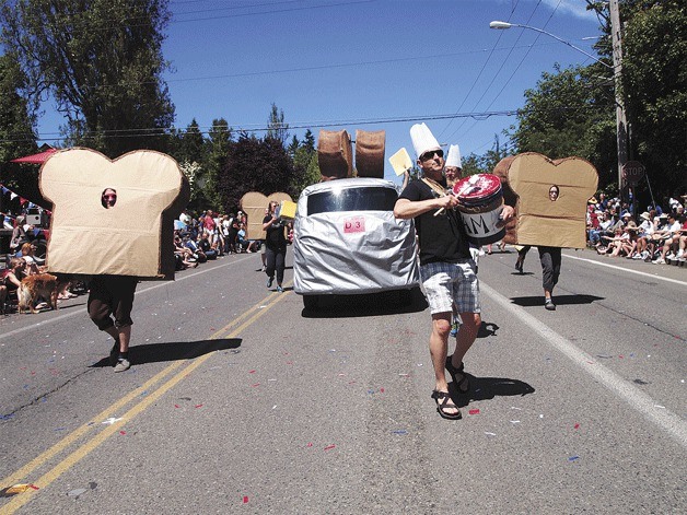 The crusty crew of Blackbird Bakery marches along Winslow Way with an “I Love Toast” theme in the island’s 2012 July 4th parade. The annual parade stretched for more than two hours along Madison Avenue and Winslow Way.