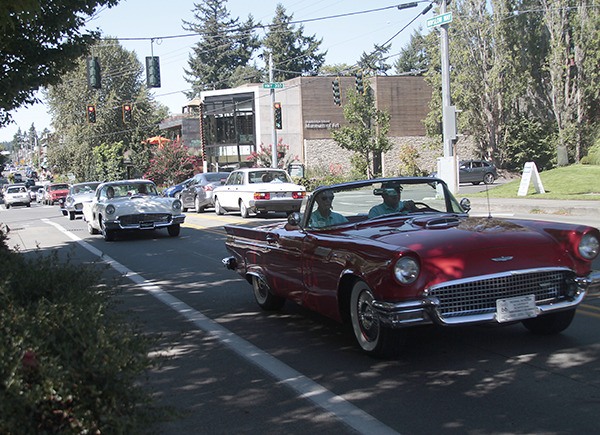 Classic Ford Thunderbirds and GM Corvettes from four regional car clubs hit the roads of Bainbridge Island Saturday