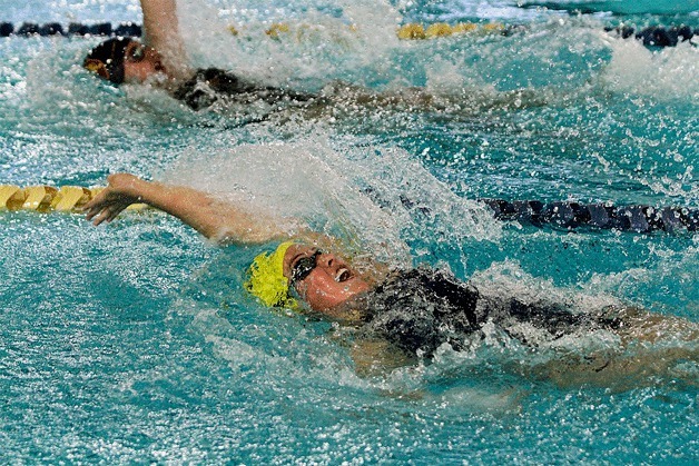 Bainbridge’s Ana Bucy swims to a fourth-place finish (1:04.02) in the 100-yard backstroke against Lakeside.