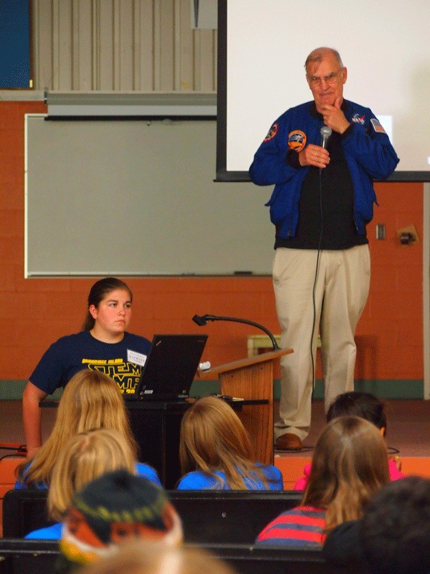 Astronaut John Fabian speaks with island students.