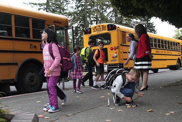 Students disembark from the buses outside of Ordway Elementary School last week on their way to the first day of classes.