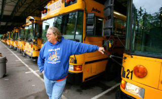 Bainbridge Island School District bus driver David Fricke waits for his bus to warm up before starting his morning route last week. The district’s transportation department is reeling from the cost of fuel