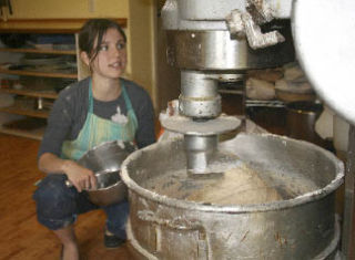 Robin Briggs mixes up a batch of whole wheat for today’s market.