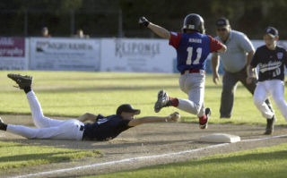 (Clockwise from top) Jake Hawken dives to first to try and get South Kitsap Southern’s Zach Ringer during Wednesday’s 12-1 win in the Little League District 2 tournament