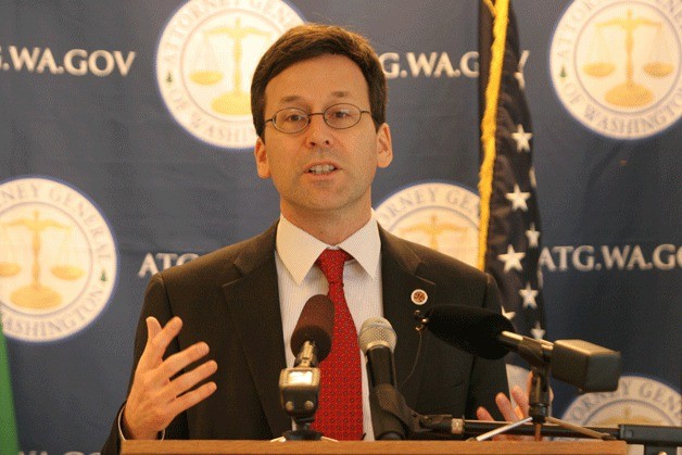 Washington State Attorney General Bob Ferguson announces criminal charges against the owner of a tugboat that sank in Eagle Harbor last October during a press conference in Seattle.