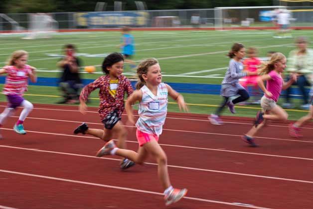 Runners are gathered in age and gender-based groups to compete in sprints of varying distances at Monday’s Kiwanis All-Comers track meet event at Bainbridge High School. The free meets happen at 6:30 p.m. every Monday evening through Aug. 10.