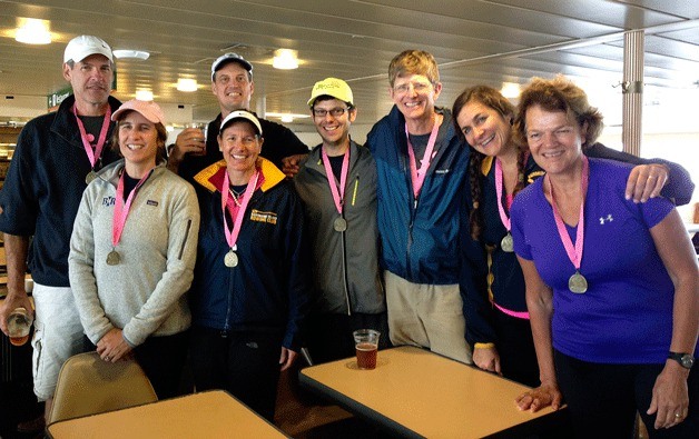 Bainbridge Island Rowing’s winning Mixed 8+ from 2013 Row for the Cure held Sept. 15 in Lake Union gather for a photo on the ferry ride home. From left