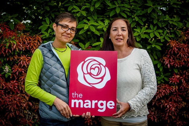 Bainbridge artist Alex Sanso and Kassia Sing with the Marge Williams Center’s new logo. The center celebrates its 15th anniversary with a community open house at 1 p.m. Saturday
