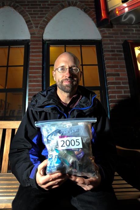 Brad Camp/Staff Photo Bainbridge resident Van Calvez holds the bag of trash he accumulated in 2005