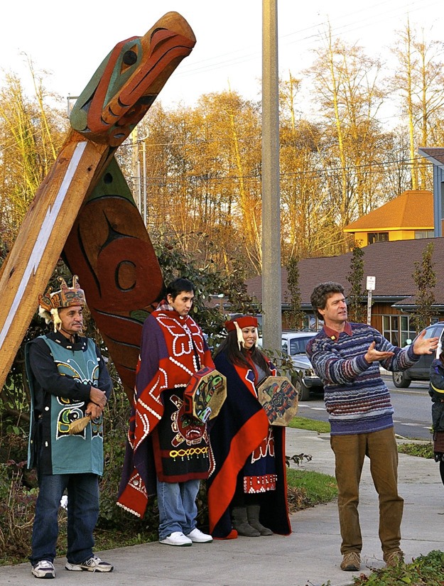 “Rainbringer” artist Craig Jacobrown (front) addresses a crowd of community members and Madrona School students on Dec. 3