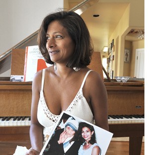Susan van Houte holds the picture of her reunited with Mother Teresa which appeared in the book