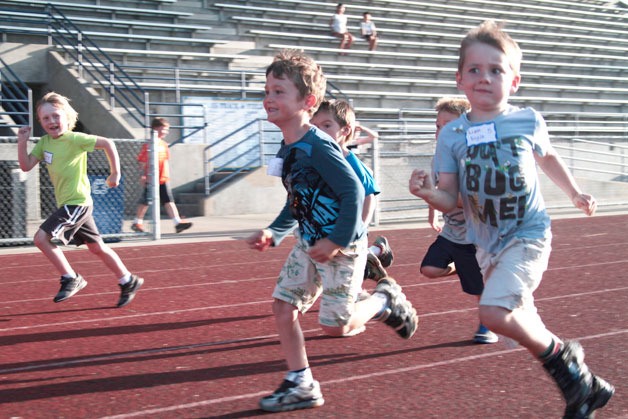 Fleet feet fly during the 100-yard dash event at Monday’s Kiwanis All-Comers Track Meet.