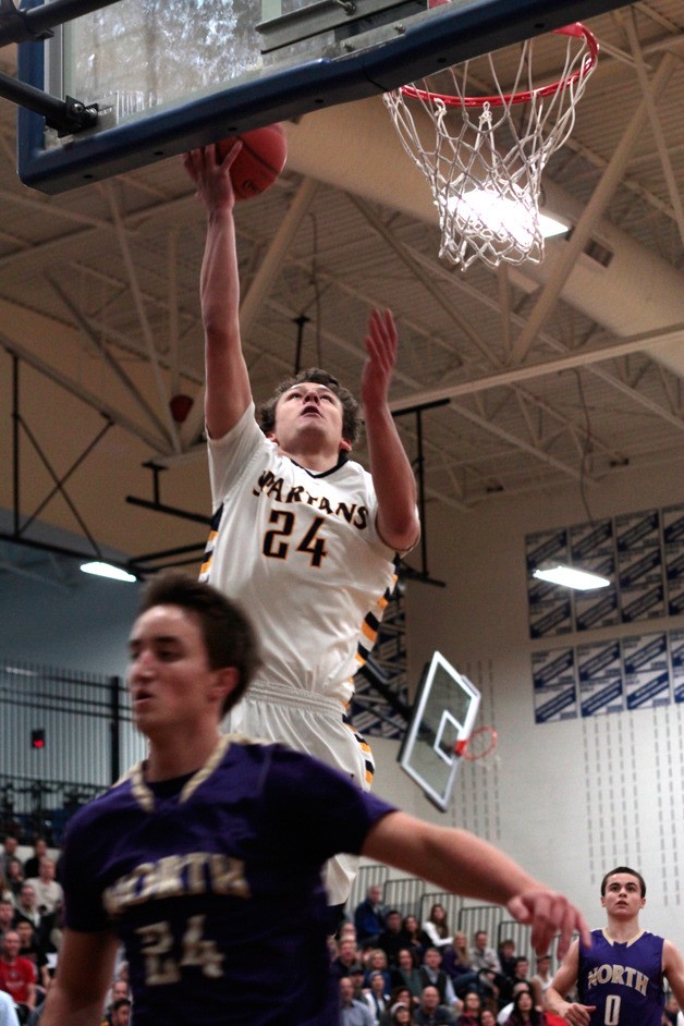 Bainbridge junior forward Lyle Terry goes in for a layup during Monday’s victorious season debut against the North Kitsap Vikings. Terry would finish the game with 16 total points