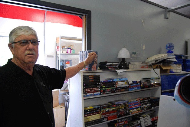 Jerry Clark stands in Silver Screen Video’s back room where he says cutting down on excess stock will be his biggest goal to get ready for the upcoming move.