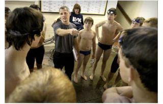 Coach Kaycee Taylor chats with the BHS boys’ swim team before practice last week. The team’s first meet is Dec. 2 at Central Kitsap.