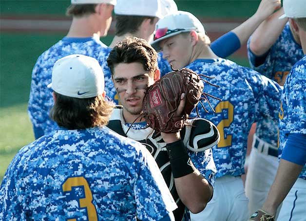 BHS catcher Truman Miller talks with pitcher Trent Schulte before the start of last week’s Metro championship game against O’Dea.