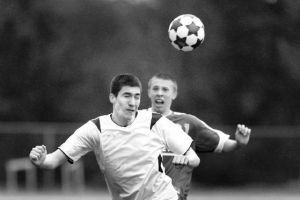 (Top) Kenji Queva heads the ball away from a Seattle Prep defender Tuesday at Memorial Stadium.  (Right) Sam Freedman scored the first goal against the Panthers. The Spartans blanked them 2-0 and are in first place.