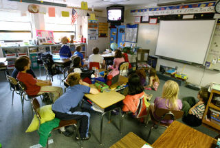 Students watch a video in a class at Wilkes Elementary School. Small and outdated classrooms are among the items of concern at the 50-year-old school. A rebuilding or renovation of Wilkes is being discussed as one option for inclusion in a second round of capital facilities improvements by Bainbridge Island School District.