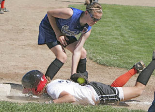 (Top) Leah Nordberg attempts to bunt during a game at the Little League state tournament in Walla Walla last weekend.  (Left) Caitlin Maguire tags out a runner at third base. Bainbridge went 1-2 at the tournament.