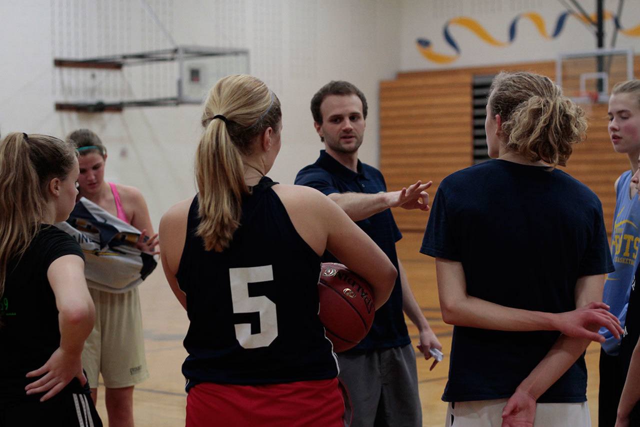 Luciano Marano | Bainbridge Island Review                                New Spartan Coach Henry Guterson offers advice during a recent break in the action during practice in Paski Gymnasium.