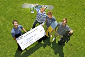 Sam Kuhn (second from left) stands with Mark Wilkerson from A to Z Sports and two of his friends from the Dusty Muffin snowboarding club as Kuhn received his check from the company Tuesday.
