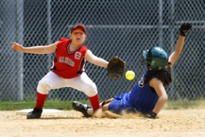 ReAnna Rapada slides to avoid the tag (and the ball) in Saturday’s 13-2 win over Key Peninsula.