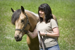 Adrienne Wolfe of Rolling Bay Farm with her Chincoteague stallion