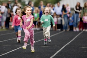3-year-old Samantha Campbell takes the lead in the 3 and under heat of the 50 meter dash during the all-comers meet on July 23. She won in a time of 15.9 seconds.