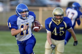 Bainbridge running back Ross Cobb looks for blockers after avoiding a Bremerton defensive player. The senior rushed for 130 yards and scored three touchdowns on just six carries as the Spartans defeated the Knights 50-22 to go 2-0 on the season.