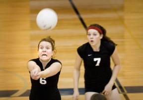 Chelsea Bell goes for the dig as Emily Donohue (right) looks on. The senior setter had 22 assists