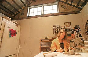 Ceramic artisit Gail Hustedde works on a small-scale project in her studio.
