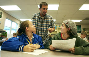 Woodward teacher Scott Orness (center) explains the fine points of leadership to Woodward Middle School students Britanny Raasch (left) and Catie Mirkovich.