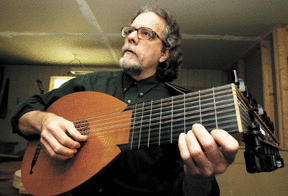 Alan Simcoe plays a lute that resembles the Renaissance instrument he is making for the Island Music Teachers Guild’s early music program. The Guild holds a concert this weekend to raise money for early instruments.