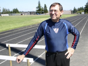 Runner Vance Jacobsen pauses during his training at the Bainbridge High School track.