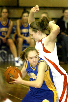 Emily Farrar fights past a Mount Si defender. She scored 10 points on Tuesday in the Spartans 54-51 loss to the Wildcats in the 3A Sea-King District 2 tournament.