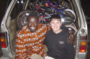 Olowo-n’djo Tchala (left) and Adrian Mason with a load of bicycles.