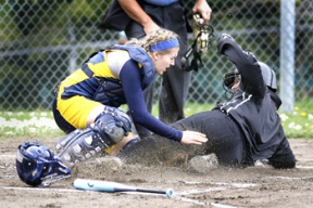 Spartan catcher Brittany Wisner tries to make the tag on a Holy Names runner in the first inning.