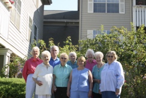 Residents of Finch Place pose for a picture outside their building this week. The 29-unit complex offers affordable housing for island seniors that will be preserved if a pending sale to the Kitsap County Consolidated Housing Authority goes through. The building