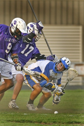 Max Olson fights for a ground ball with two Garfield defenders on him in Wednesday's state semifinal win over the Bulldogs.