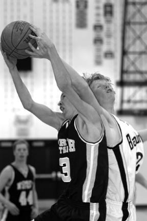 Grant Leslie (right) battles for a rebound against North Kitsap last season