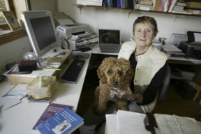 Sally Robison and dog about town Drake in the author’s Winslow home office.