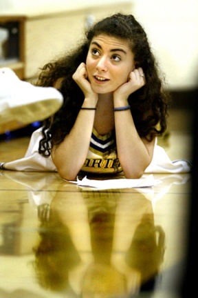 Bainbridge High School sophomore Alexandra Agosta takes advantage at halftime during the girls basketball game Wednesday to study for a biology final.