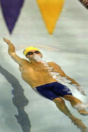 Austin Hallett comes up for air during the 100 backstroke at the 3A Sea-King District 2 meet.