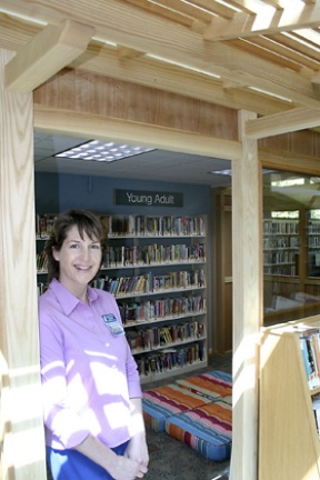 Bainbridge’s Young People’s Librarian Sharon Snyder stands outside the library’s new Teen Scene.