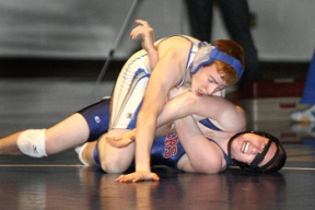 Bainbridge’s Brian Robert (on top) works for the pin against Nathan Hale’s Josh Arndt. Robert won the match by a 11-6 decision. The Spartans defeated the Raiders 48-20 Thursday night.