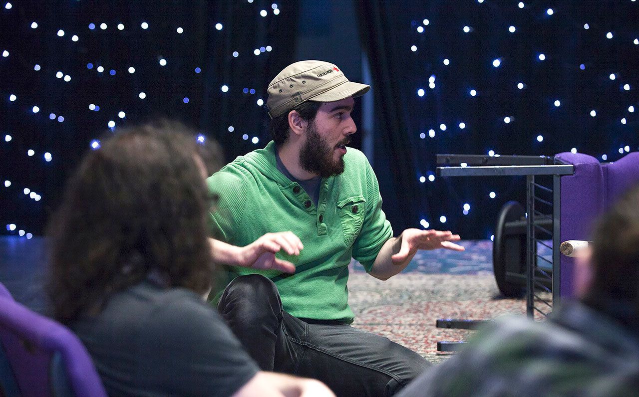 Derek Villanueva photo                                Director Mike Lion addresses the gathered cast during a recent rehearsal of “The Snow Queen,” a joint production by the Lesser-Known Players and Dacha, a Seattle-based immersive theater group, at Rolling Bay Hall.