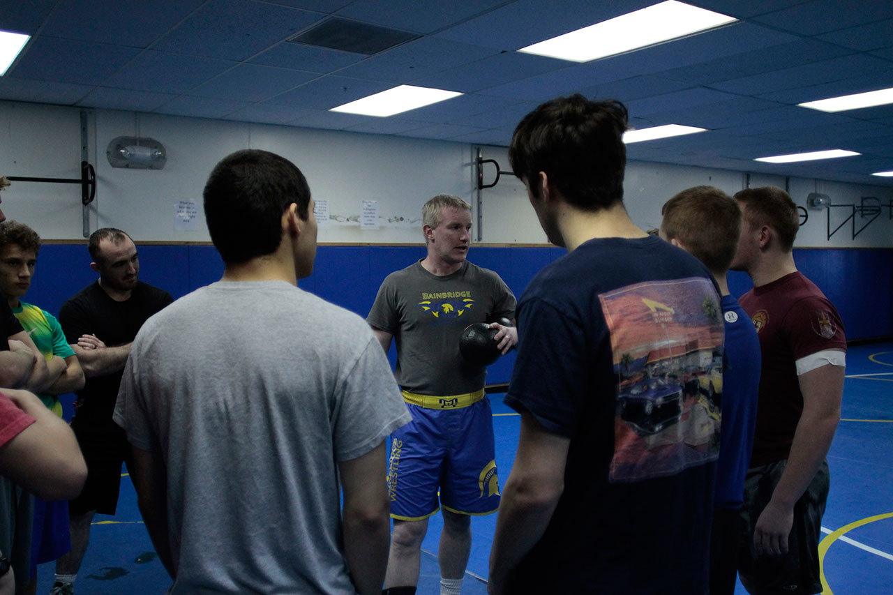 Luciano Marano | Bainbridge Island Review                                Spartan Head Coach Dan Pippinger talks with the varsity wrestling team prior to the start of practice last week.